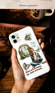 Detail of vintage coffee and reading themed stickers on a white smartphone case