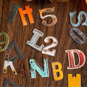 Industrial vintage metal letters and numbers set with rusty patina for DIY home decor
