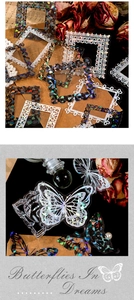 Dettaglio macro di adesivi PET laser con cornici in pizzo vintage e farfalle decorative