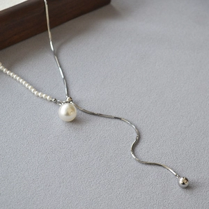 Long adjustable pearl necklace with silver snake chain and Y-shaped pendant design