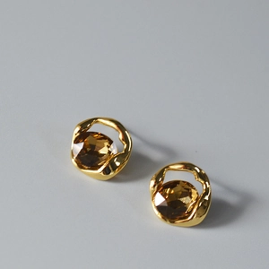 Irregular hollow golden studs with amber gemstone and faceted crystal design