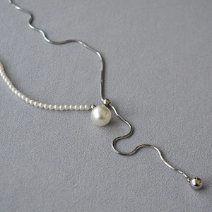 Long adjustable silver snake chain necklace with elegant white pearls and a Y-shaped pendant