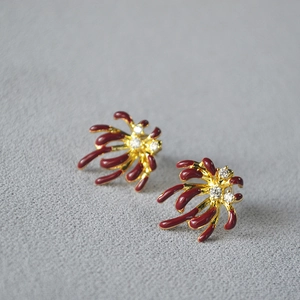 Vintage gold-plated fireworks stud earrings with red enamel and sparkling zircons