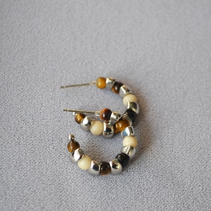 Vintage silver beaded C-shaped hoop earrings featuring natural tiger eye stones