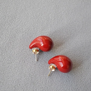 Close-up of red waterdrop enamel stud earrings with 925 silver needles and silicone backs