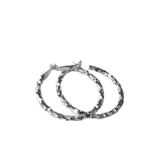 Sparkling silver textured irregular hoop earrings with a minimalist high-end metal finish