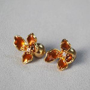 Retro amber enamel flower earrings with golden pearl backing and center crystal accent