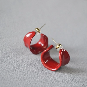 Retro Angola red enamel wide C-shape earrings with silver studs on gray texture