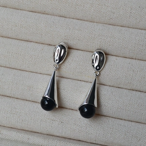 Modern long drop earrings with black onyx beads and irregular silver textured metal