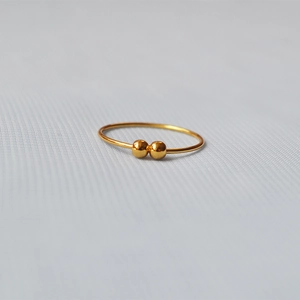 Minimalist gold-plated brass ring featuring double sliding beads on a thin band