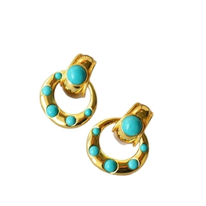Vintage style gold-plated brass earrings with inlaid turquoise stones in a retro aesthetic