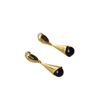 Minimalist long teardrop gold earrings with black onyx beads on white background