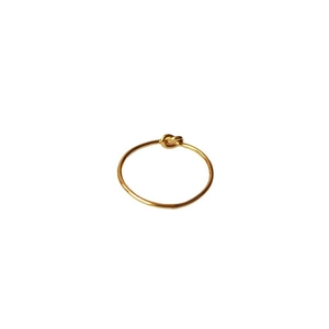 Minimalist handmade gold plated brass wire woven knot ring for women on white background