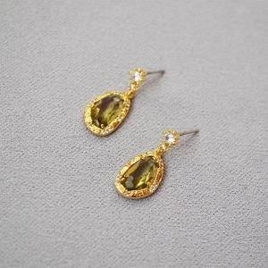 Elegant gold-plated teardrop earrings featuring olive green crystal and zircon accents