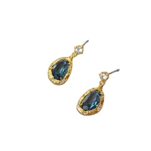 Elegant gold brass stud earrings with deep blue teardrop crystal and pave accents