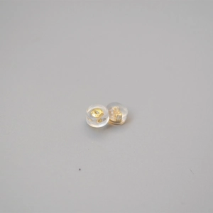 Close-up of gold plated bullet earring back with anti-slip silicone for ear studs