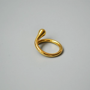 Macro shot of 18K gold plated teardrop open ring showing high-polish finish details