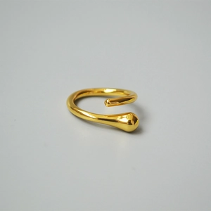 Detail shot of 18K gold plated brass teardrop ring with high polish finish