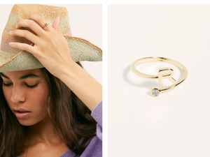 Detailed close-up and lifestyle view of an adjustable gold letter R ring with a small zircon
