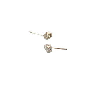 Irregular silver lava stone stud earrings with a natural minimalist raw texture design