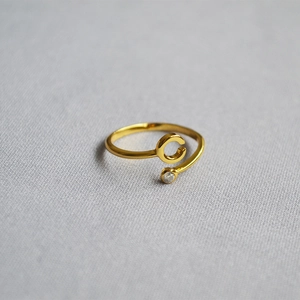 Macro shot of 18K gold-plated adjustable letter C ring with a cubic zirconia stone