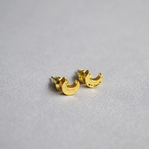 Hammered crescent moon stud earrings in gold plated brass with natural texture