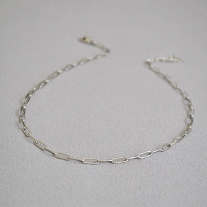 Detail of silver paperclip link chain necklace with lobster clasp and extension