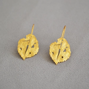 Matte gold leaf earrings featuring artistic textures and nature-inspired hollow design