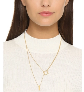 Close-up of double-layer gold geometric square and cylinder pendant necklace for women