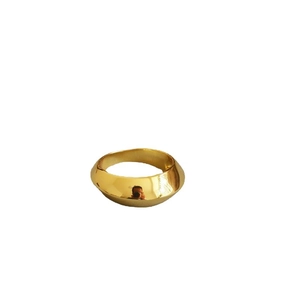 Polished golden wide geometric ring with a minimalist curved brass design for women