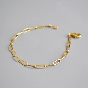 Minimalist gold plated paperclip chain bracelet for women featuring an elegant lobster clasp