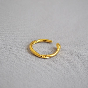 Minimalist gold-plated twisted open ring with adjustable band and polished finish
