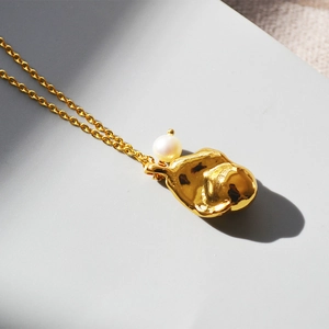 Minimalist gold brass necklace with baroque freshwater pearl and irregular lava pendant
