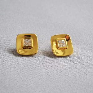 Detailed close-up of 18K gold plated square zircon stud earrings with s925 silver pins