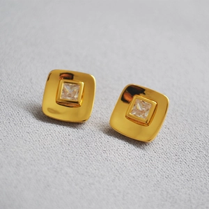 Macro shot of 18K gold plated square zircon studs with 925 silver needles