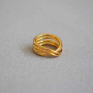 Elegant gold multi-layer intertwined knot ring in a modern minimalist style for women