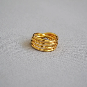 Top view of a gold-plated multi-layer twisted knot ring with a polished minimalist finish