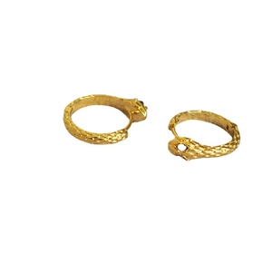 Retro golden snake hoop earrings with detailed scale texture and minimalist design style