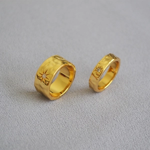 Hammered gold wave texture rings set with engraved North Star and zircon detail