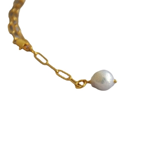Golden paperclip chain necklace featuring a baroque freshwater pearl drop pendant