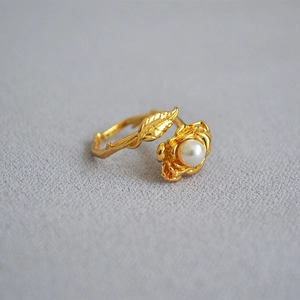 Vintage rose and leaf open ring with white pearl in gold finish on grey texture