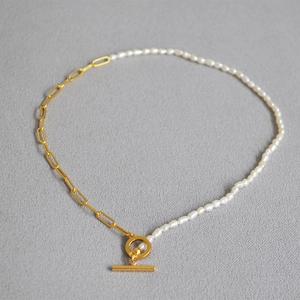 Detail of freshwater pearl necklace with golden paperclip chain and toggle clasp