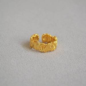 Detailed view of the woven wire texture on a gold minimalist open ring for women