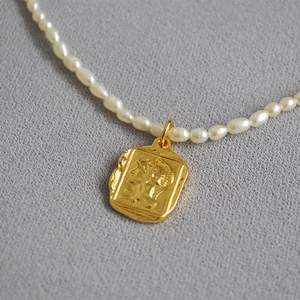French vintage freshwater pearl necklace featuring a golden square Roman relief coin pendant