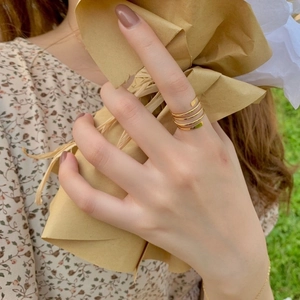 Handcrafted gold multilayer spiral wrap ring with polished finish and open design