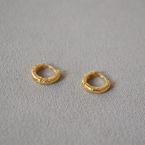 Minimalist gold hoop earrings with irregular hammered lava texture for women