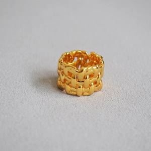 Irregular woven mesh wide band ring in gold plated brass with a textured design