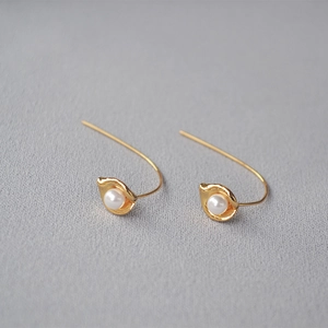 Minimalist gold calla lily drop earrings with white pearl detail for daily wear