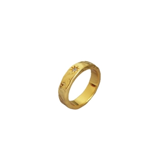 Minimalist gold plated brass ring with water ripple texture and North Star engraving