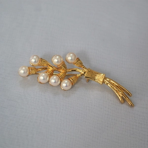 Vintage gold flower bouquet brooch with glossy pearls and textured branches for sweaters
